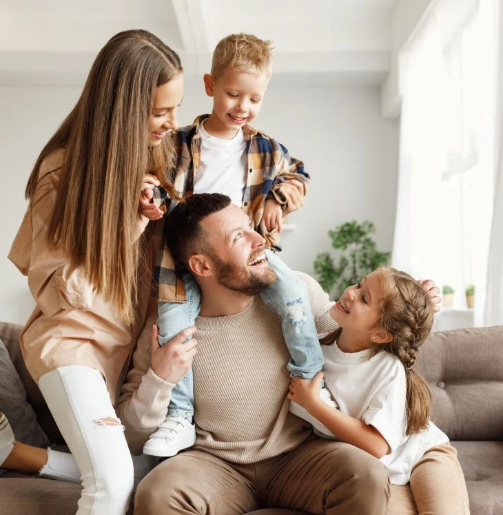 A happy family laughing together at home