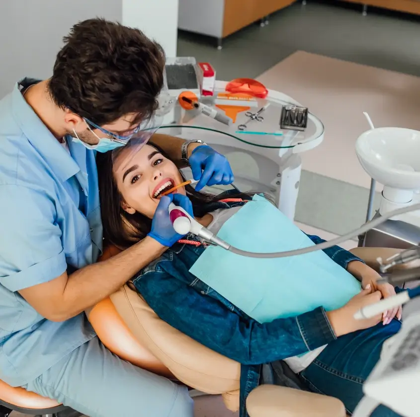 A relaxed patient smiling during a routine cleaning