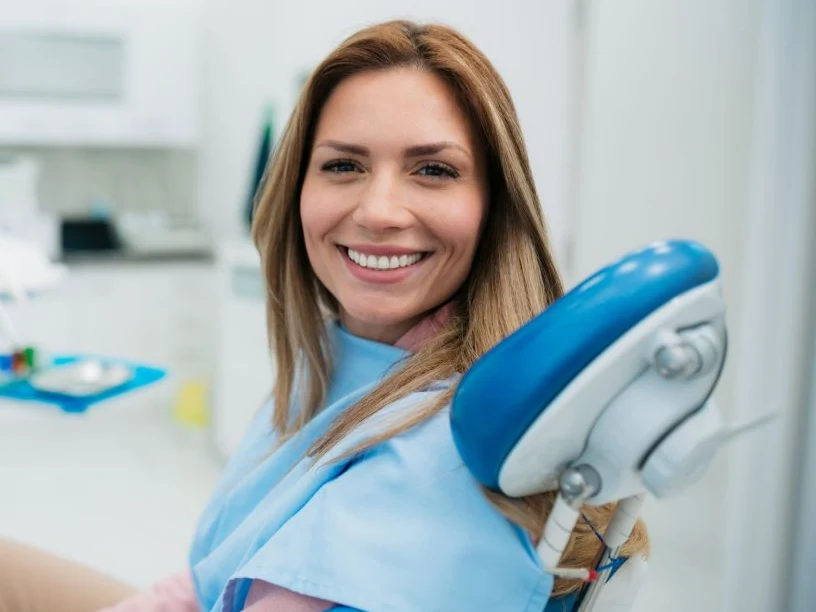 A relaxed, smiling patient in the dental chair